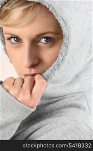 blonde woman wearing a warm hood