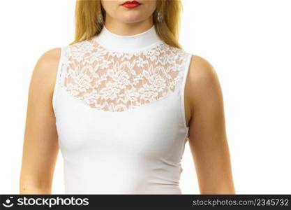 Blonde woman wearing white top with laced detail on cleavage. Fashion, clothing style concept.. Woman wearing white top