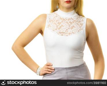 Blonde woman wearing white top with laced detail on cleavage. Fashion, clothing style concept.. Woman wearing white top