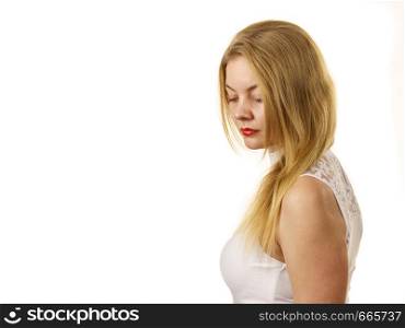 Blonde woman wearing white top with laced detail on cleavage. Fashion, clothing style concept.. Woman wearing white laced top
