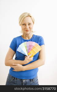 Blonde woman with colour swatches