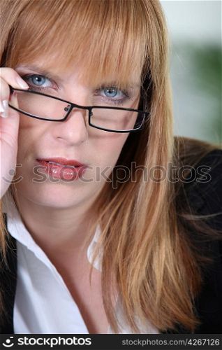 Blonde woman with glasses