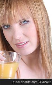Blonde woman with orange juice