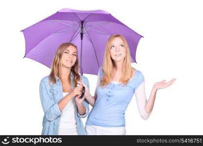 Blonde women under a umbrella