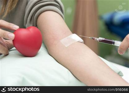Blood collect by nurse in the hospital with red heart, Blood test examination and donate concept. Hospital and health care concept