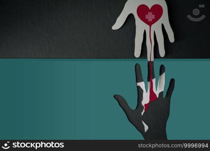 Blood Donation Concept. Help, Care, Love, Support. Paper Cut as Hand Shape hanging on the wall. look like the top one with a Red Heart and Cross Giving Blood to the one below