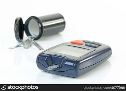 Blood glucose meter as used to monitor diabetes. Shallow d.o.f