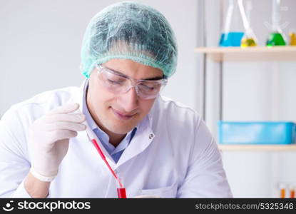 Blood testing in the lab with young scientist