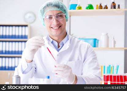 Blood testing in the lab with young scientist