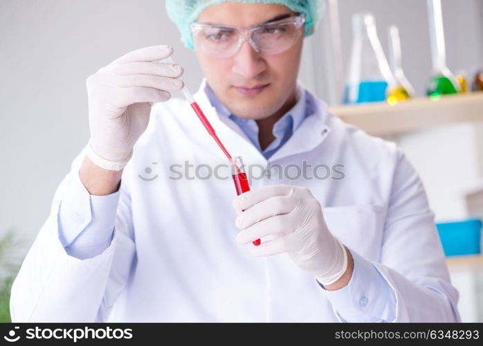 Blood testing in the lab with young scientist