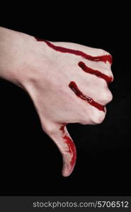 bloody human hand on black background