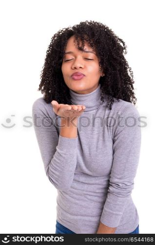 Blow me a kiss!. Beautiful african young woman blowing you a kiss, isolated over white