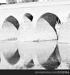 blu in iran the old bridge and the river antique construction near nature