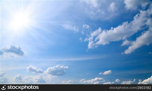 Blu sky with clouds and sun