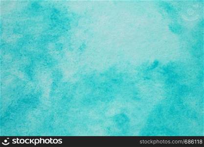 Blue abstract watercolour painting textured on white paper background