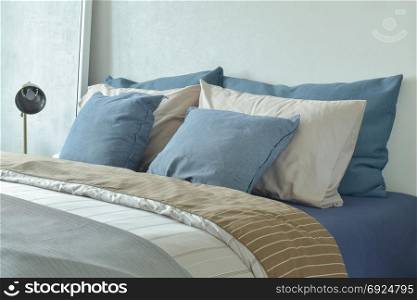 Blue and gray color scheme bedding with reading lamp