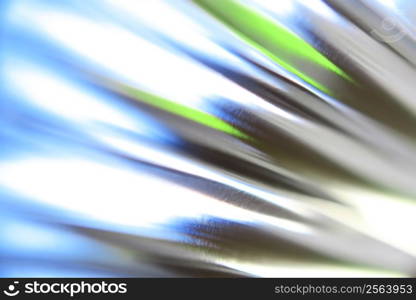 Blue and green chrome reflection creates an abstract background