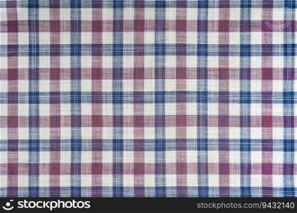 Blue and pink checkered texture fabric, tartan pattern. Shirt fabric, tablecloth textile, linen plaid cloth, classic scottish check pattern. Backdrop, wallpaper, background.