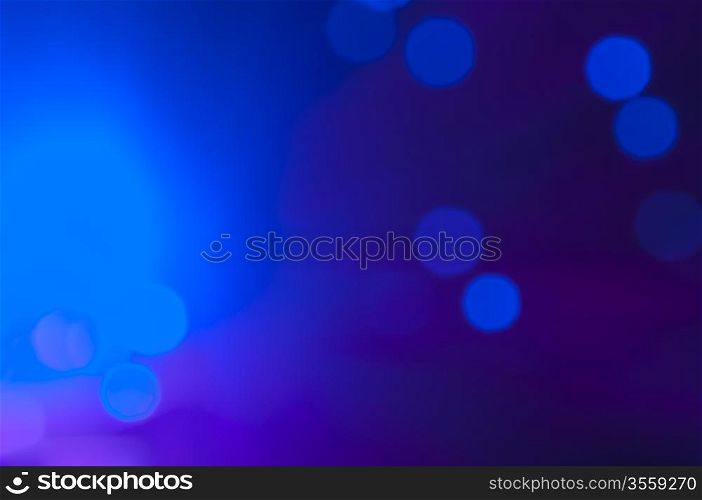 Blue and pink festive lights and circles background. Blurred christmas lights
