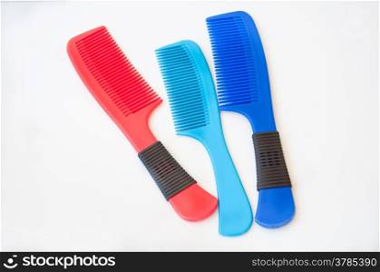 blue and re comb on white background