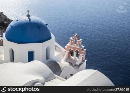 Blue and white church of Oia village ,Santorini, Greece