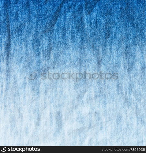 blue and white gradient on denim jean - textile background close up