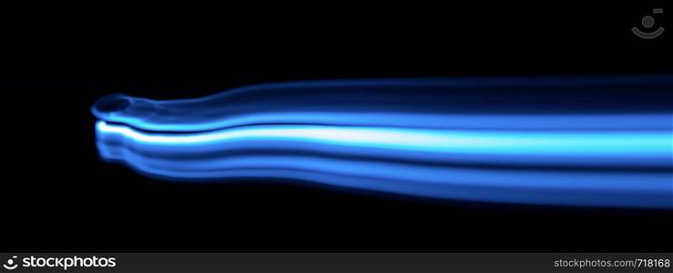 Blue and white streaks of light over black background with copy space for concept about natural gas
