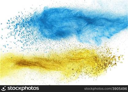 Blue and yellow powder explosion isolated on white