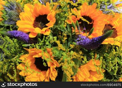 Blue and yellow wedding flowers: sunflowers and eryngium or sea holly