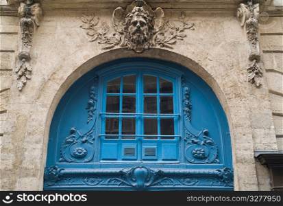 Blue arched exterior of a building in Paris France