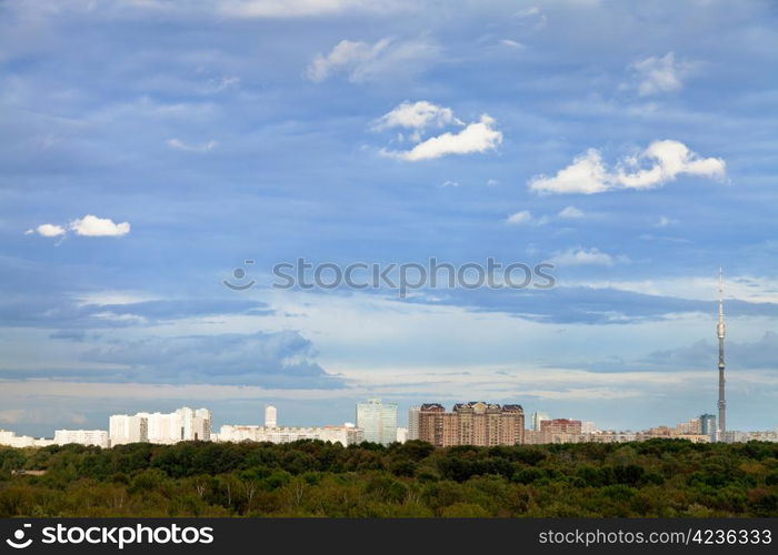 blue autumn sky with white clouds under city