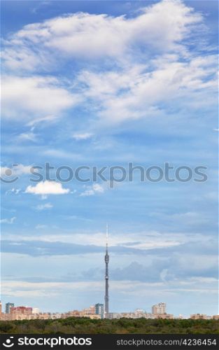 blue autumn sky with white clouds under town