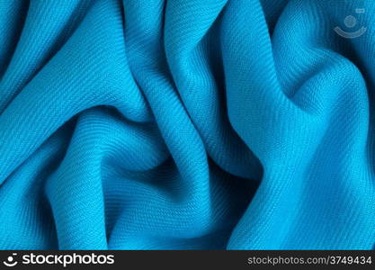 Blue background abstract cloth wavy folds of textile texture wallpaper design of elegant material