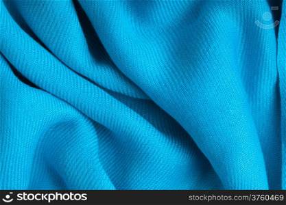 Blue background abstract cloth wavy folds of textile texture wallpaper design of elegant material
