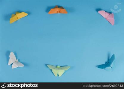 blue background with frame made butterflies