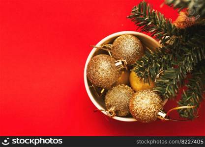 blue balls and toys in a white cup with a branch of a Christmas tree on a purple background. Very Peri color of the year. blue balls and toys in a white cup with a branch of a Christmas tree. Very Peri color of the year