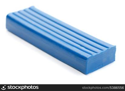 Blue bar of plasticine isolated on white