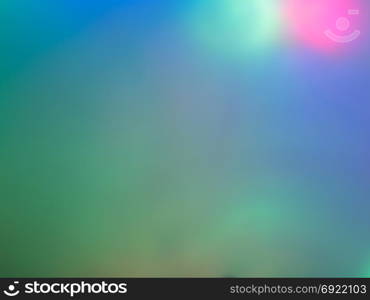 Blue blurred background with multicolored color spots