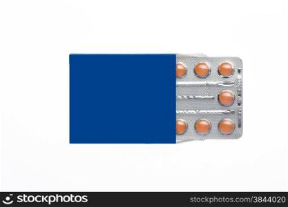 Blue box with brown pills blister pack on an isolated background. Blue box with brown pills blister pack