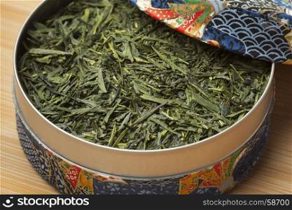 Blue box with Japanese green tea leaves