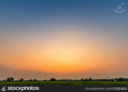 blue bright dramatic sunset sky cuts the orange color in countryside or colorful cloudscape texture air background.