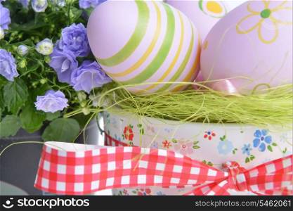 blue campanula flowers and easter eggs