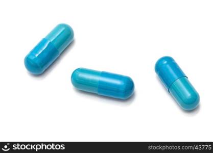 Blue capsules isolated on white