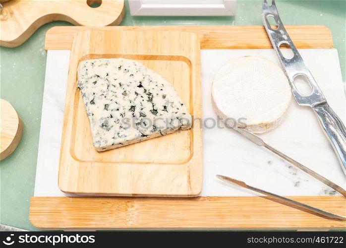 Blue Cheese on rustic wooden table in buffet line