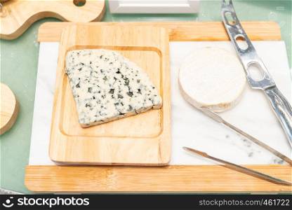 Blue Cheese on rustic wooden table in buffet line