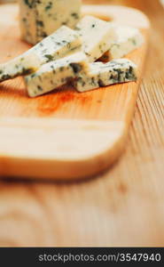 Blue cheese on wood plate