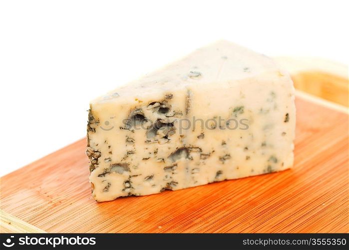 Blue cheese on wood plate