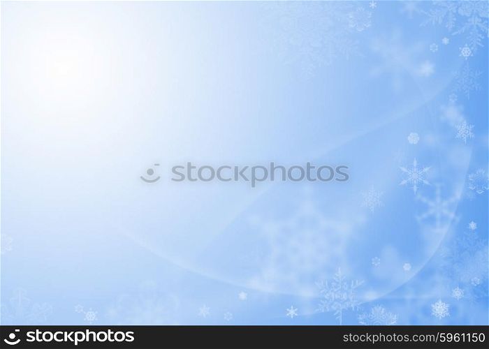 Blue christmas background with white snowflakes