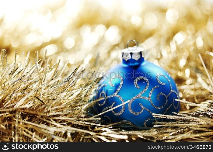 blue christmas ball on golden background