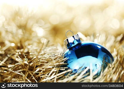 blue christmas ball on golden background